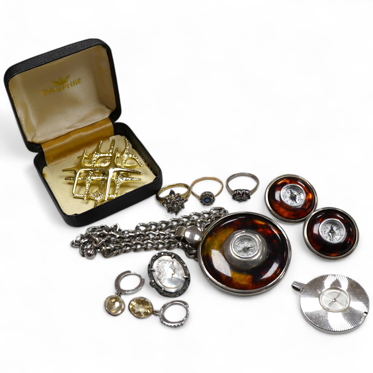 A collection of jewels, comprising: a coated topaz cluster ring in gold, stamped 9ct; a synthetic sapphire and colourless paste cluster ring in gold, stamped 9CT; an amethyst and colourless paste ring in silver, British